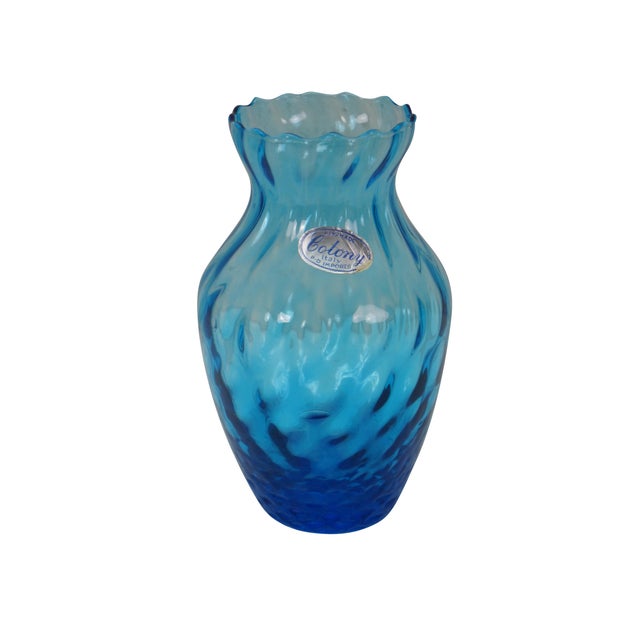 This collection includes a blue glass Mary Gregory style decanter with a stopper, a Colony Imports Italy vase with ruffled...