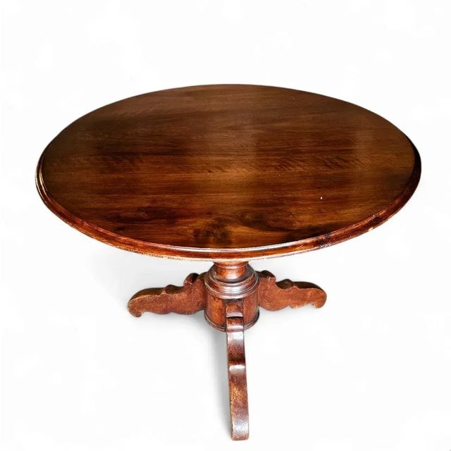 Elevate your space with the timeless elegance of this Italian Renaissance-style walnut pedestal table, crafted in the...