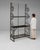 Here is a etagere/shelf, its black scrolled wrought iron the first thing to catch the eye. The piece dates to 20th...