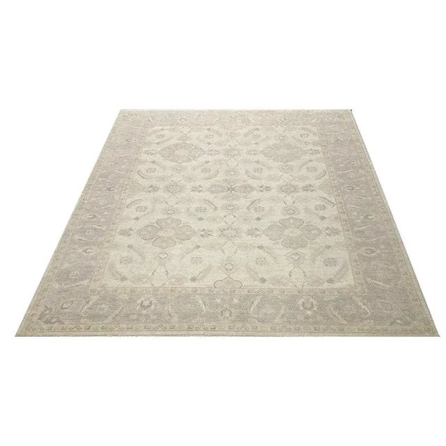 ACTUAL SIZE: 9’1″ x 11’7″ PRIMARY COLOR: Ivory / Gray AGE: New ORIGIN: Pakistan MATERIALS: Wool FOUNDATION: Cotton...