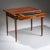 An elegant Neoclassical desk featuring one drawer and a sliding tabletop. The piece is beautifully veneered and hand-...
