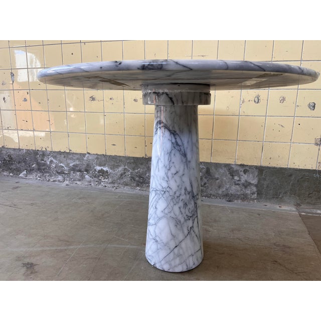 This beautiful vintage dining table in solid marble features a striking and sculptural design, with an elegant conical...