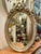 French Oval Wall Mirror – Silver Leaf Frame With Ribbon Crest For Sale - Image 3 of 3