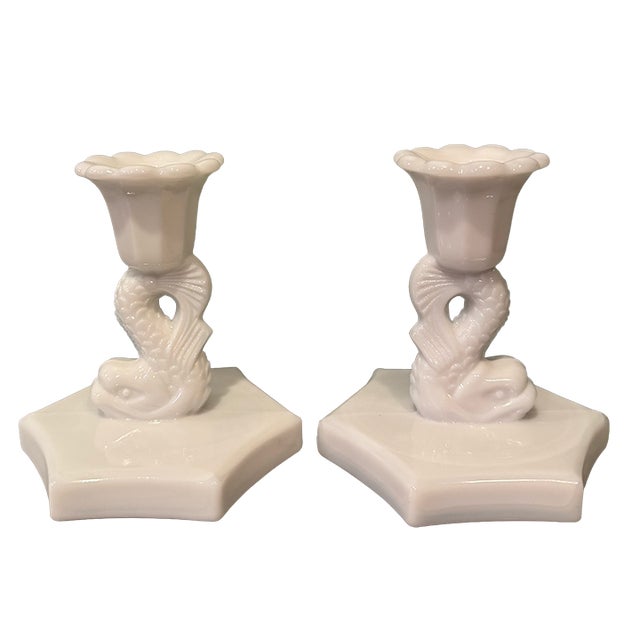 Charming pair of vintage milk glass candlesticks featuring sculptural figural fish forms—resembling koi or...