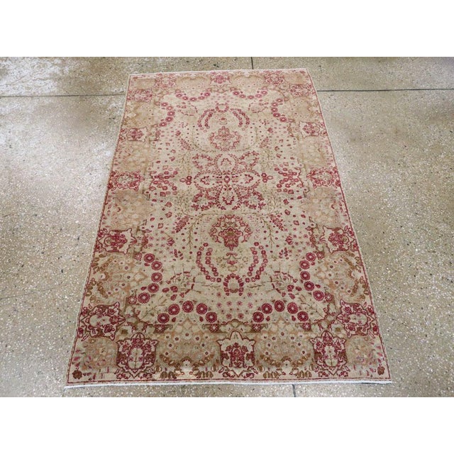 This early 20th century Persian Lavar Kerman rug, measuring 3' 0" x 4' 10", features a finely drawn allover medallion-and-...