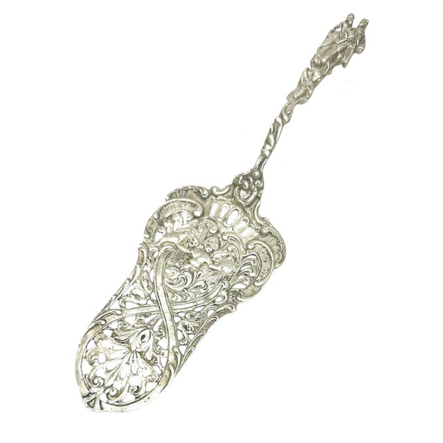 An antique Italian rococo style silver plate dessert server. Can be used for asparagus too. Has an Italian mark. Circa...