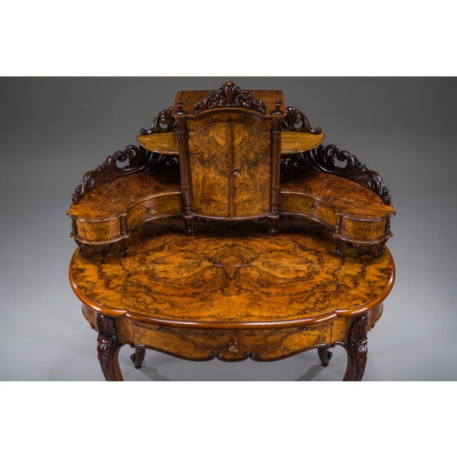 An elegant Louis Philippe walnut secretary vanity desk dating to circa 1850–1860, featuring beautifully figured walnut...