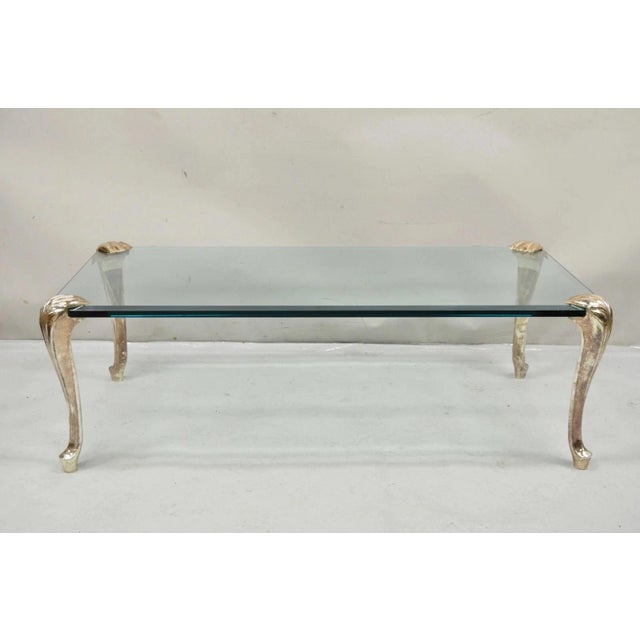Vintage French Hollywood Regency Beveled Glass Bronze Cabriole Leg Coffee Table. Item features intentional manufacturer...