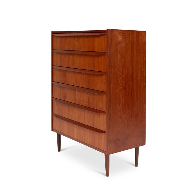 This stunning 1960s Danish Mid-Century teak tallboy dresser is a timeless piece of craftsmanship. Featuring exquisite wood...