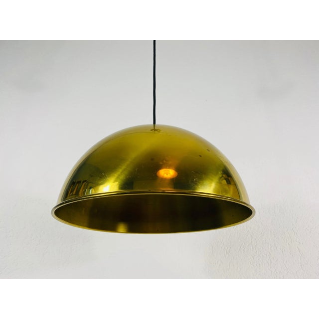 Counter balance pendant designed by Florian Schulz and made in Germany in the 1970s. It is fascinating with its Exclusive...