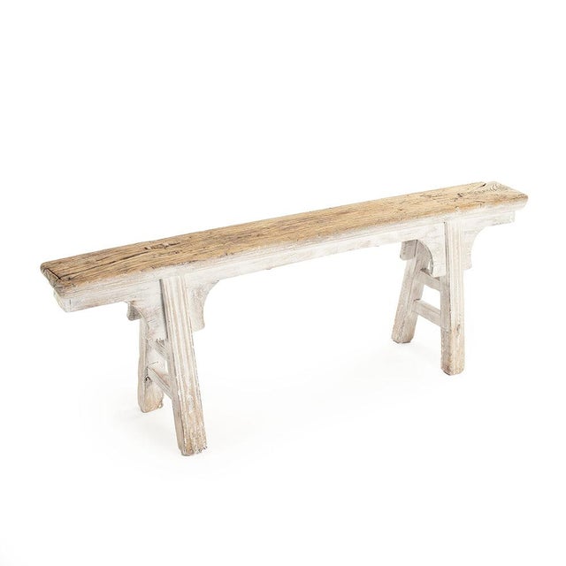 The Story Bench in White from Zentique is a minimalist reclaimed elm bench with a thick plank seat on simple straight...