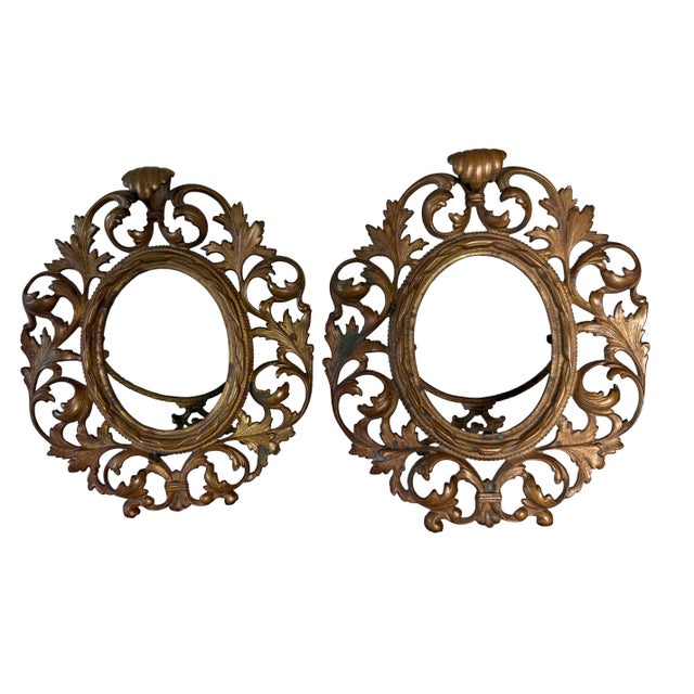 A beautifully ornate pair of antique Rococo Revival tabletop frames, crafted in cast brass with a warm gilt finish. Each...
