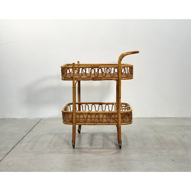 Rattan and bamboo bar trolley from the 70s, the height at the shelves is 21 and 58 cm.