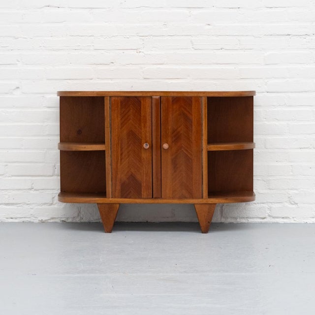 Refined mid-century cabinet from the 1940s/50s, made in France and crafted from solid mahogany with veneered doors...