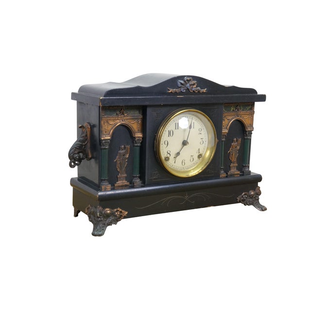 Antique Victorian Sessions Clock Company key wound, chiming mantel clock. Black lacquered wood finish with brass foliate...