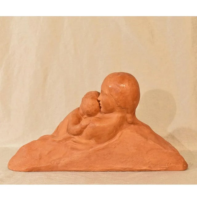 The Art Déco Sculpture proposed here is in Terracotta. Earthenware sculpture. Mom and Baby, Maternity, made in the early...