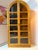 An exceptional arched display cabinet from Dyrlund, crafted from teak. The striking, architectural arched shape and two...