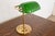 A gorgeous Art Deco banker's desk lamp USA, Circa Mid-20th Century Brass, with beautiful green glass shade. Measures:...