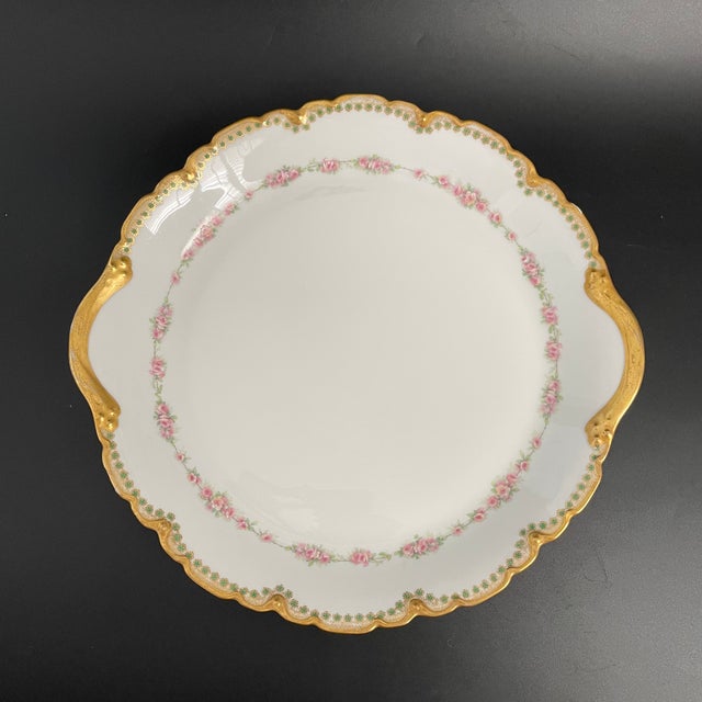 A stunning antique Theodore Haviland Limoges scalloped platter, decorated with a delicate pink rose garland and hand-...