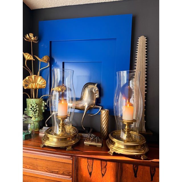 Pair of brass and glass large scale hurricanes by Chapman. Only glass is 7” diameter and 18” tall Requires 3" diameter...