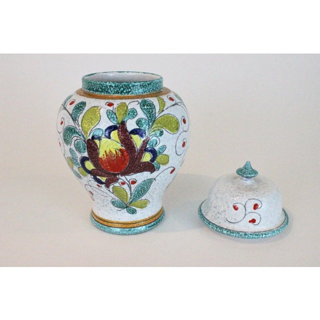 Lovely hand painted Italian ginger jar with floral motif. 1950s vintage and in excellent cosmetic condition. Measures...