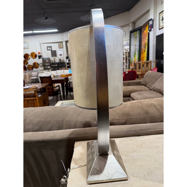 A striking blend of art and function, this Artmax table lamp embodies the brand’s signature approach to sculptural,...