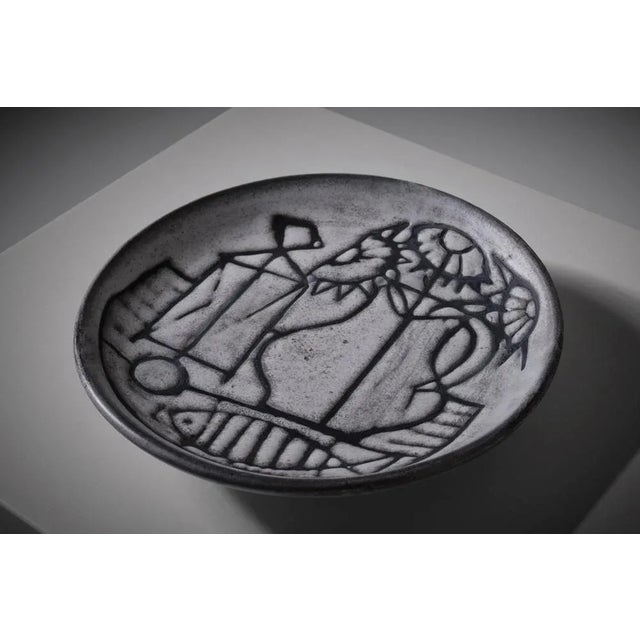 Large flat bowl by Jacques Pouchain (1927 - 2015) for Atelier Dieulefit, France 1950s. Jacques Pouchain was trained as an...