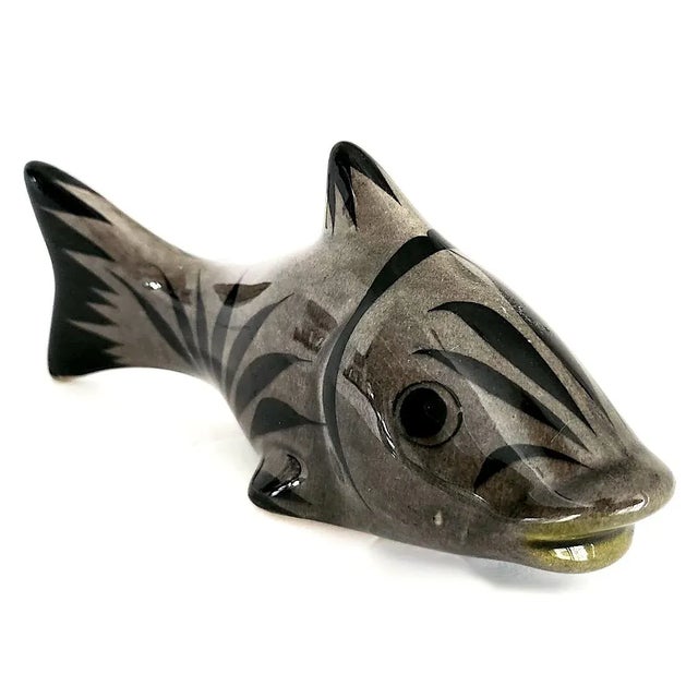 Offered is a vintage 1970s burnished ceramic fish figurine from Tonalá in Jalisco, Mexico and created by Ken Edwards...