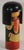 Kokeshi or Kokashi doll handmade by Japanese artisans from wood. The dolls have a simple trunk as a body and an enlarged...