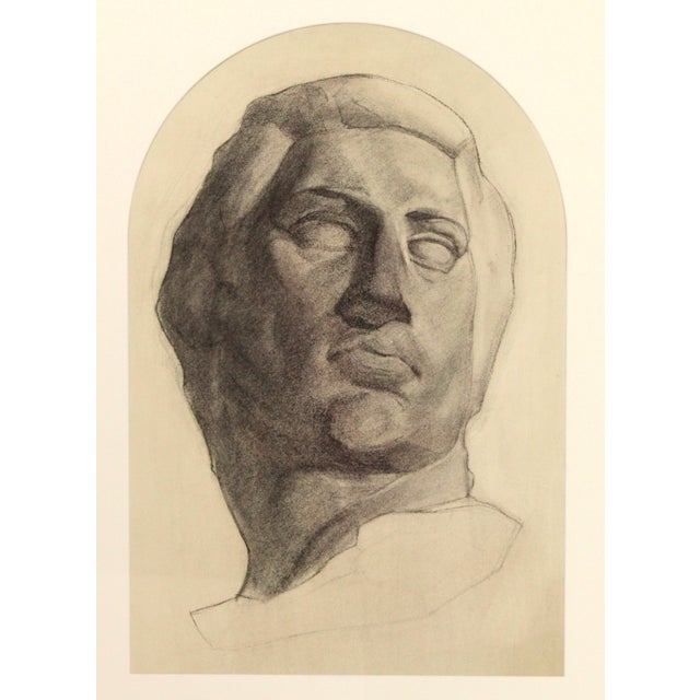 Bold pencil drawing of a young male bust sculpture. Custom framed with a unique arched mat opening and golden ash stained...