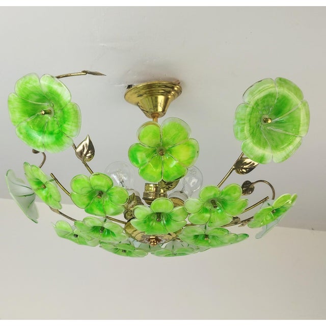 This exquisite flush mount chandelier is a unique reinterpretation of 1970s and 1980s Murano glass lighting. The floral...