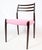 Mahogany dining table chairs, model 78, designed by N.O Møller and manufactured by JL Møller. Upholstered with pink...
