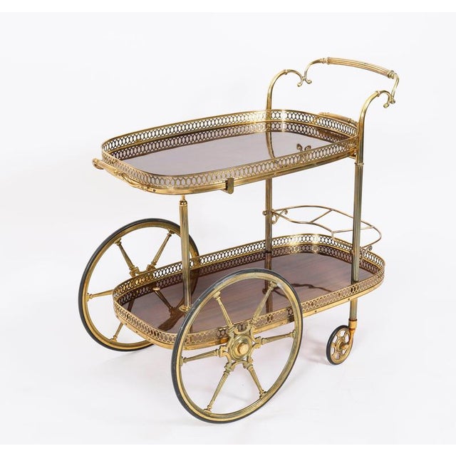 This is a very entertaining vintage two tier French drinks trolley, mid-century in date, It has a decorative fluted scroll...