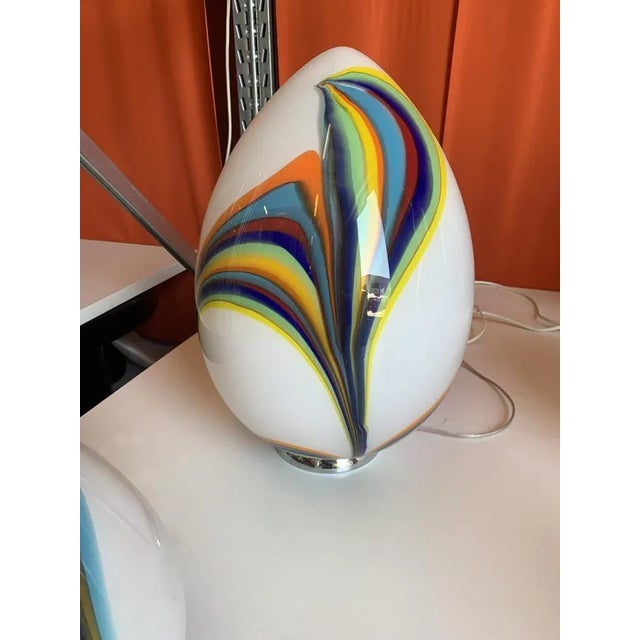 White egg lamp in Murano glass with multicolored reeds fused together. Glass rods create spectacular and scenographic...