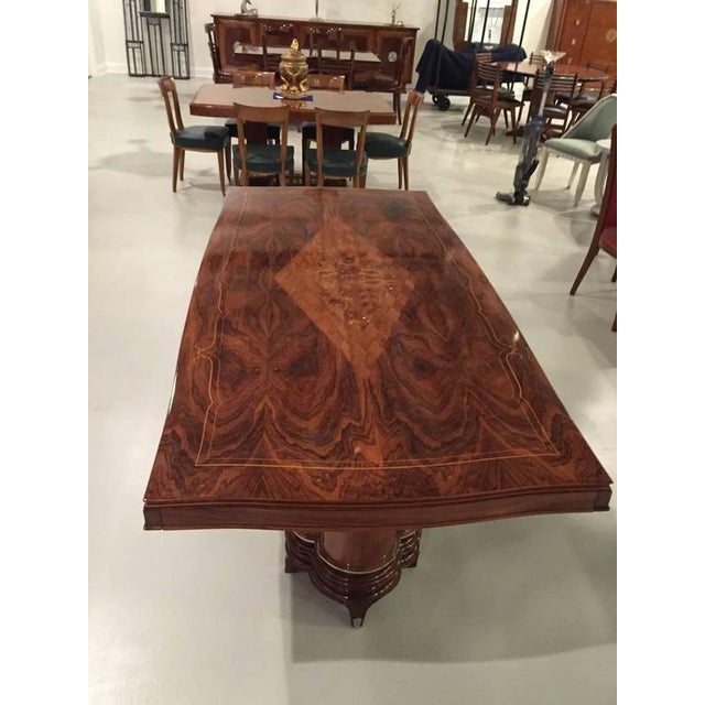 This amazing French Art Deco dining table is in the style of Jules Leleu. Can be extended with two leaves on either side...