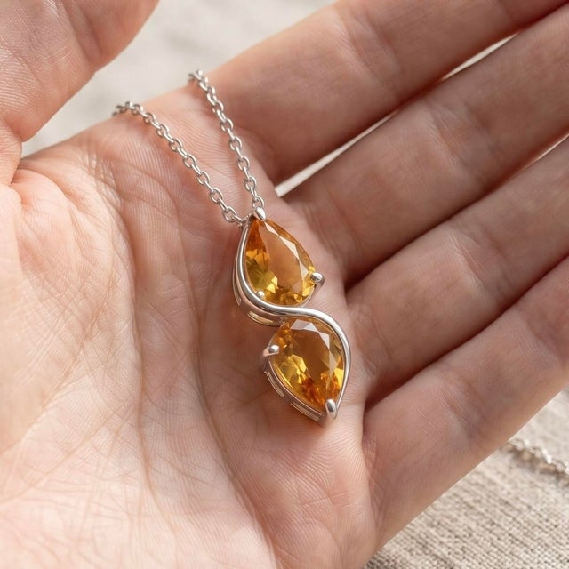 Gracefully designed to capture fluid elegance, this pendant showcases a refined balance of modern artistry and timeless...