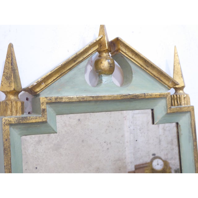 This small Italian wooden mirror measures 19.5"H x 11.75"W and has distressed speckled mirror.