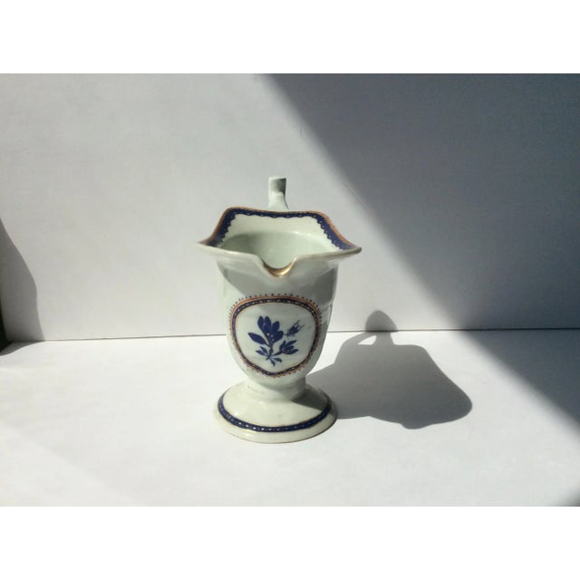 18th Century Chinese Export Porcelain helmet style pitcher this is pre 1800's. It has nice gold and blue decorations.
