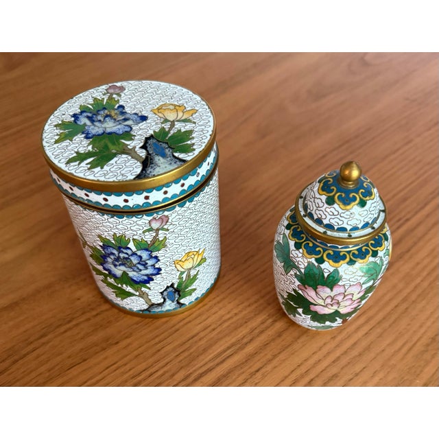 A beautifully cohesive pair of Chinese cloisonné enamel covered vessels, almost certainly from the same workshop — sharing...