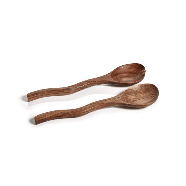These curvy mango wood salad servers are a great addition to any table setting. The set includes a fork and a spoon,...
