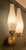 A pair of wall lights dating from around 1950, featuring double arms, polished brass brackets with a wall-mounted frame...