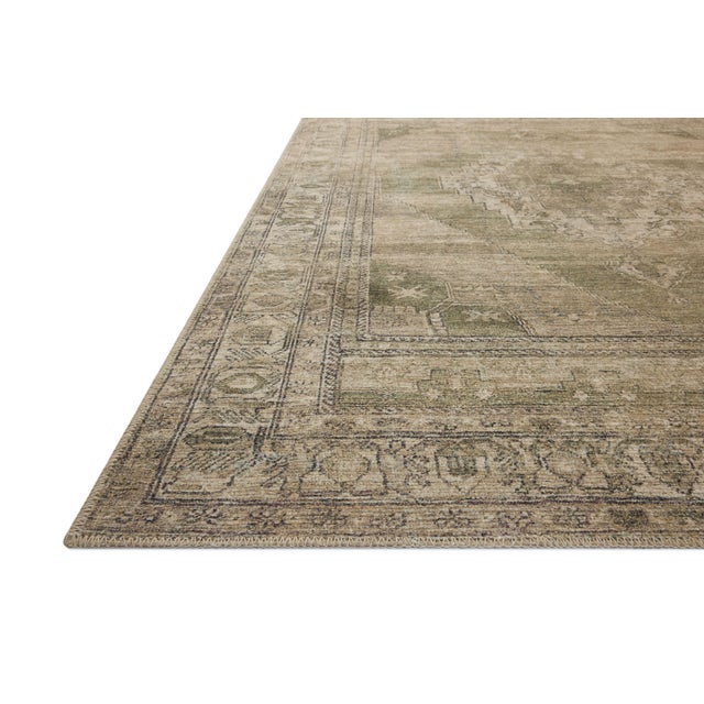The Cambria Collection is a beautifully executed vintage-style area rug from Amber Lewis x Loloi with a blended jute and...