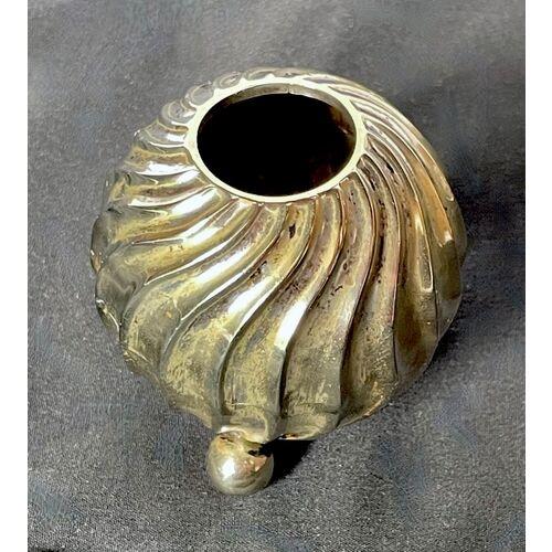 Vintage brass/silverplated vase with three small ball feet. Swirl pattern design. No maker's marks.
