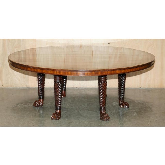 Absolutely exquisite extra large, Flamed Mahogany with Macassar ebony boarder dining table in the manner of Thomas Home...