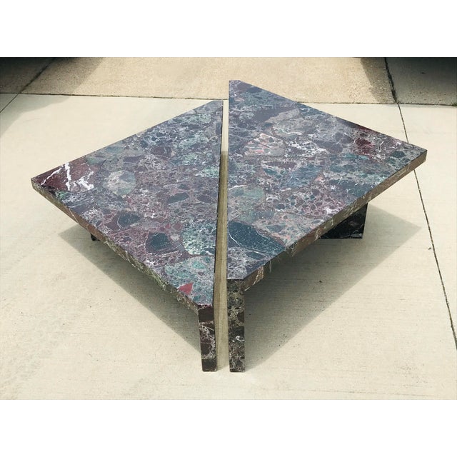 This stunning coffee table has two separate, triangular forms of polished multi-colored marble with two inch lip with...