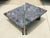 This stunning coffee table has two separate, triangular forms of polished multi-colored marble with two inch lip with...