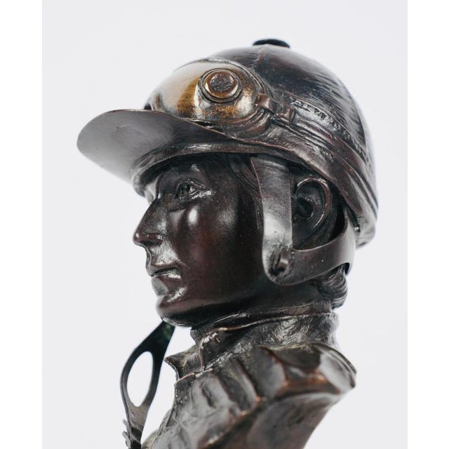 Marcel Jovine (1921-2003), Bust of a Jockey patinated bronze, 1978, signed and dated in casting, 10 in. high Born 1921...