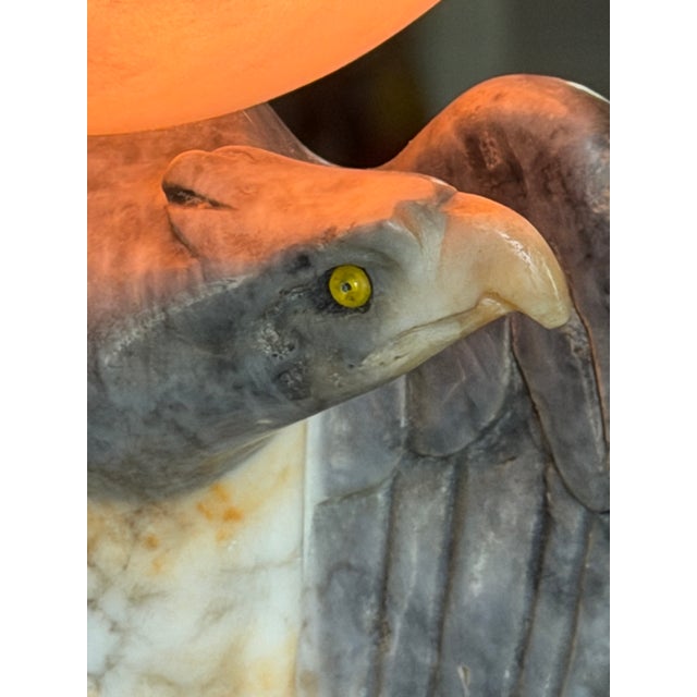 A captivating piece of Italian craftsmanship, this early-to-mid 20th century alabaster lamp features a heraldic eagle with...