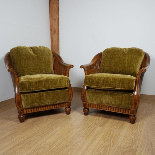 An early to mid 20th century pair of Beregére Lounge chairs. Solid walnut with original caning in good overall condition....