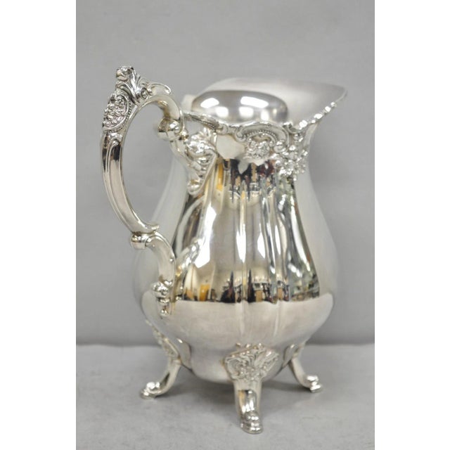 Vintage Baroque by Wallace 267 Silver Plated Footed Lemonade Water Pitcher. Circa Mid 20th Century. Measurements: 10" H x...